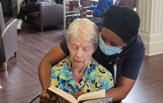 staff-helping-resident-read-01 (1)